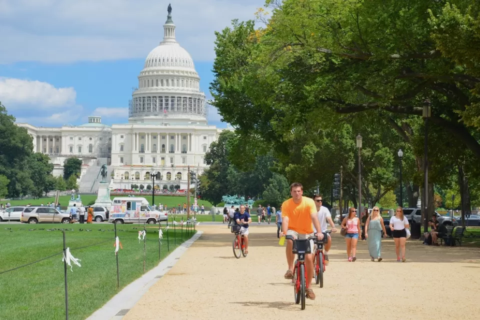 People on bikes in front of the U.S. Capitol in Washington, D.C.